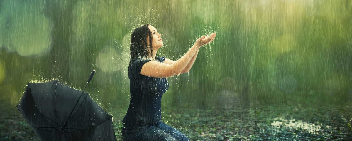 mom praying in the rain with ads outstretched