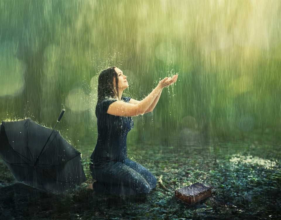 mom praying in the rain with ads outstretched